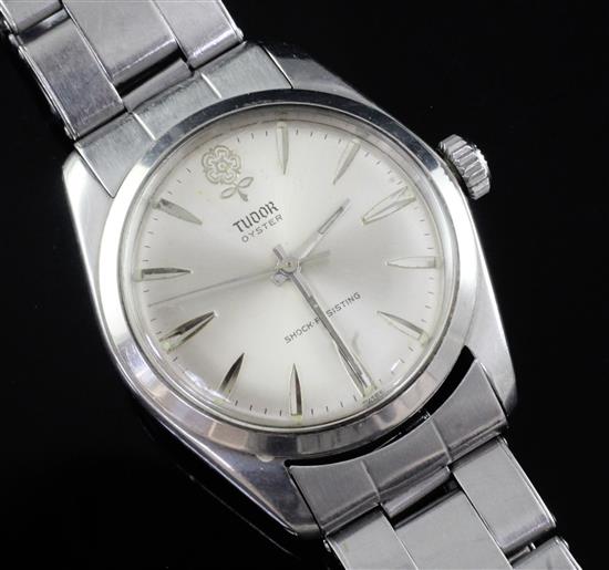 A gentlemans 1960s stainless steel Tudor Oyster manual wind wrist watch, with Tudor case.